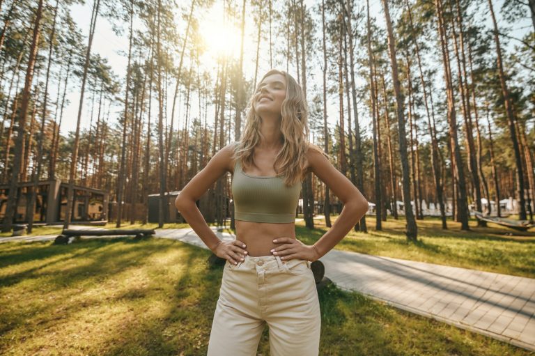 Smiling woman with closed eyes in nature EMDR Therapy Los Angeles